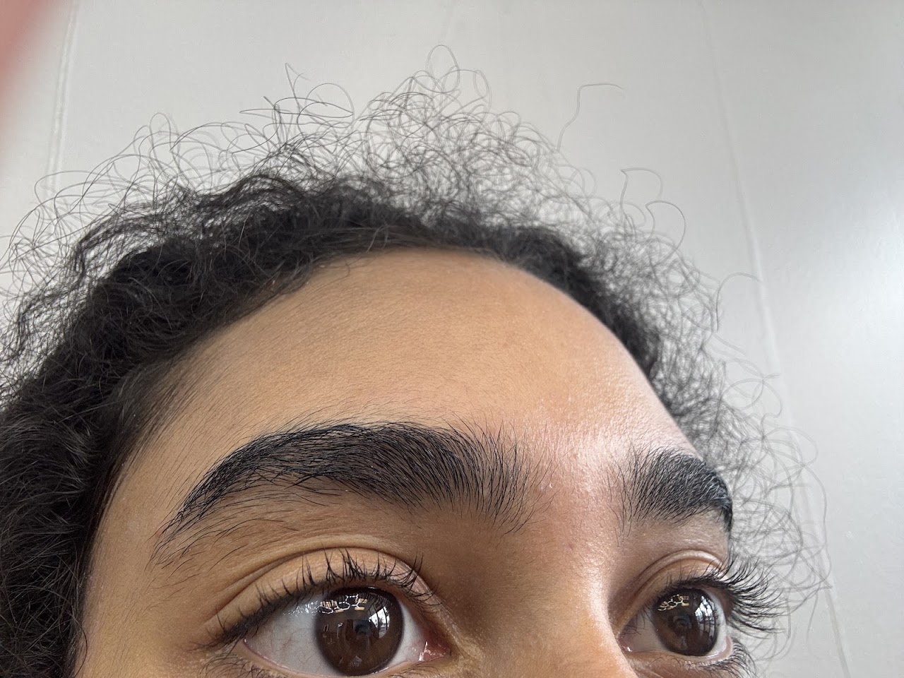 Precision eyebrow threading detail